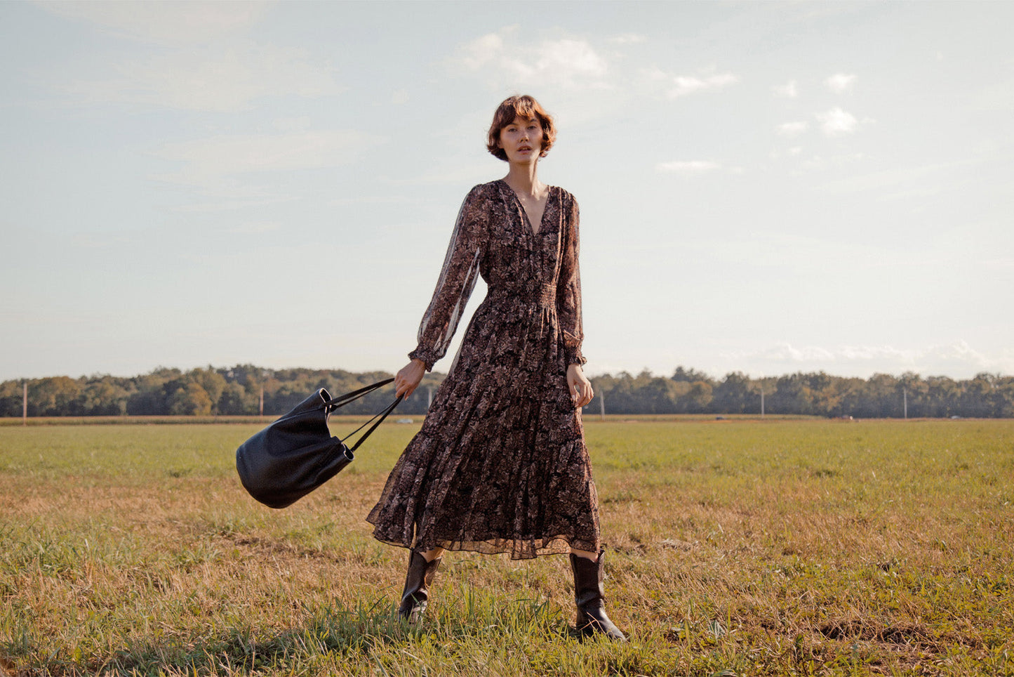 Woman in the Hudson Valley, NY holding a smoother leather bag by Per Lei New York